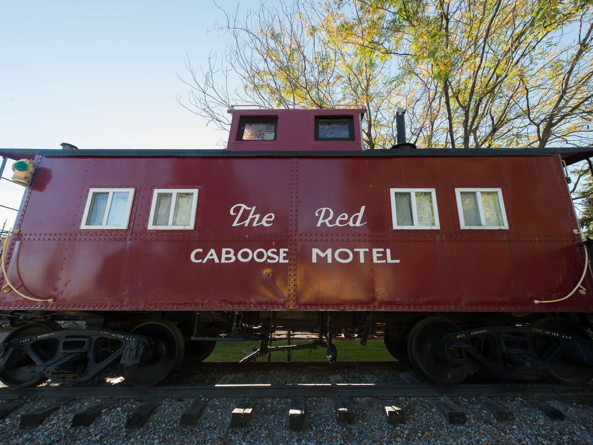 red train caboose featuring big sign for Red Caboose Motel
