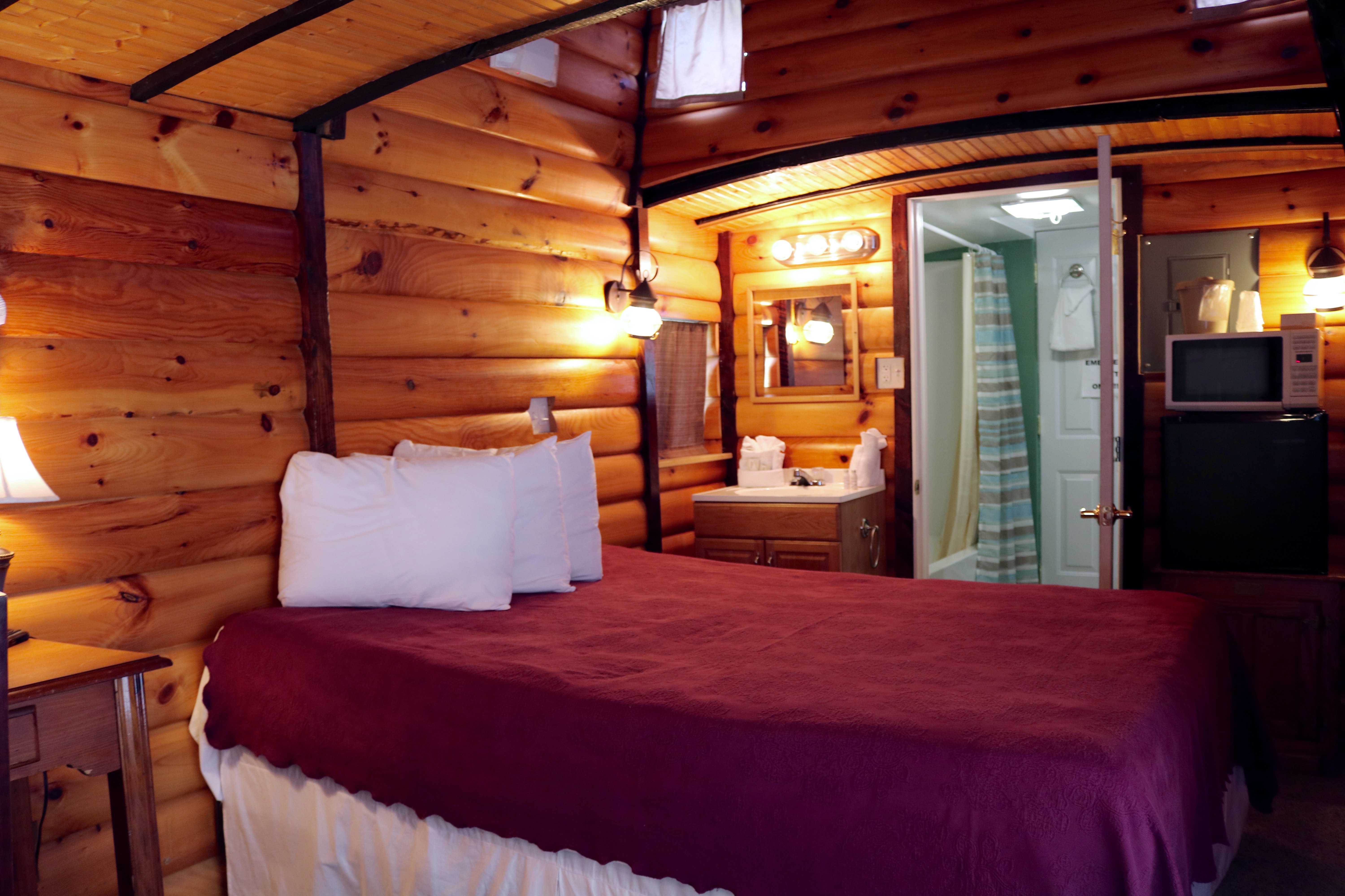 interior view of queen couples caboose motel room
